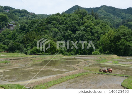Rice paddies and tractors before rice planting (Terasaka Rice Terraces / Yokose, Yokose-machi, Chichibu-gun, Saitama Prefecture) Rice paddies and tractors before rice planting (Terasaka Rice Terraces / Yokose, Yokose-machi, Chichibu-gun, Saitama Prefecture) 140525493