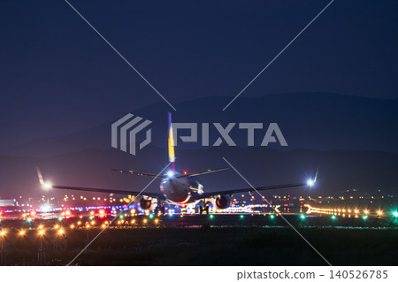 Sendai Airport at night, plane taking off, Natori City, Miyagi Prefecture Sendai Airport at night, plane taking off, Natori City, Miyagi Prefecture 140526785