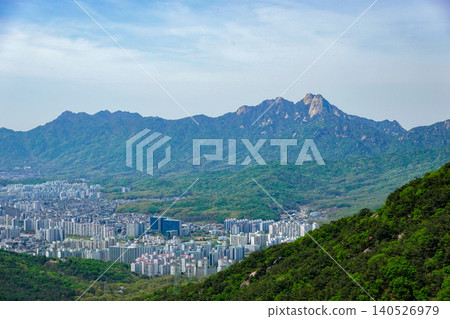 Panoramic view of Seoul cityscape surrounded by green mountains and Bukhansan ridge Panoramic view of Seoul cityscape surrounded by green mountains and Bukhansan ridge 140526979