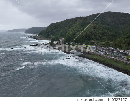Early morning aerial photograph of Tosa-Shirahama Station and coastal settlements in Kuroshio Town, Kochi Prefecture. Early morning aerial photograph of Tosa-Shirahama Station and coastal settlements in Kuroshio Town, Kochi Prefecture. 140527157