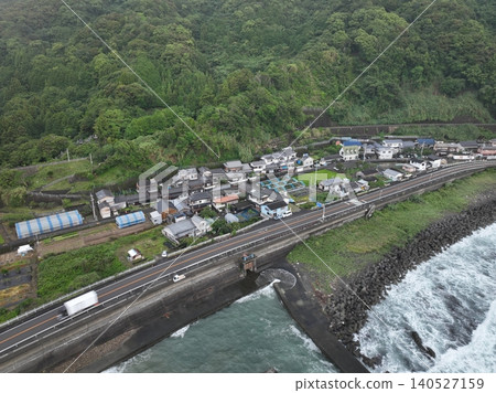 Early morning aerial photograph of Tosa-Shirahama Station and coastal settlements in Kuroshio Town, Kochi Prefecture. Early morning aerial photograph of Tosa-Shirahama Station and coastal settlements in Kuroshio Town, Kochi Prefecture. 140527159