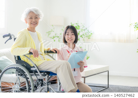 Smiling senior woman and care staff Smiling senior woman and care staff 140527462