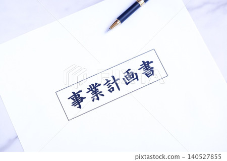 Business Plan - Image of an entrepreneur creating a business plan prior to launching a new business 140527855