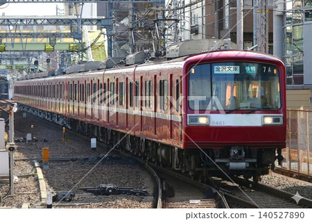 A Keikyu 2000 series limited express train bound for Kanazawa-Bunko speeds along. A Keikyu 2000 series limited express train bound for Kanazawa-Bunko speeds along. 140527890