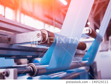 Modern automated production line in factory. Plastic bag manufacturing process Modern automated production line in factory. Plastic bag manufacturing process 140528111