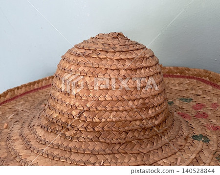 Close Up Of Traditional Woven Straw Hat Crown Texture Close Up Of Traditional Woven Straw Hat Crown Texture 140528844