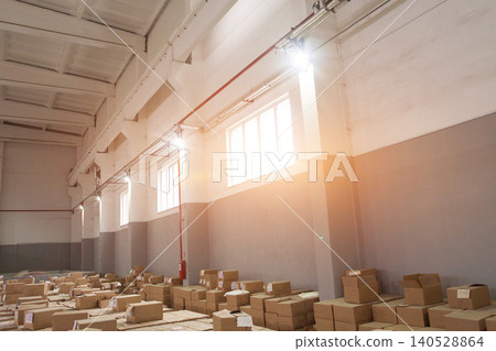 A modern warehouse with a large number of cardboard boxes in which industrial and food products are stored, as well as pharmaceutical products. Copy space A modern warehouse with a large number of cardboard boxes in which industrial and food products are stored, as well as pharmaceutical products. Copy space 140528864