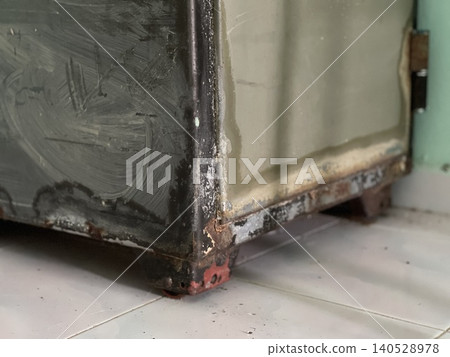 Rusty Old Metal Safe Box Showing Corrosion and Faded Paint Rusty Old Metal Safe Box Showing Corrosion and Faded Paint 140528978
