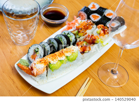 Set of rolls with fish on a white plate Set of rolls with fish on a white plate 140529040