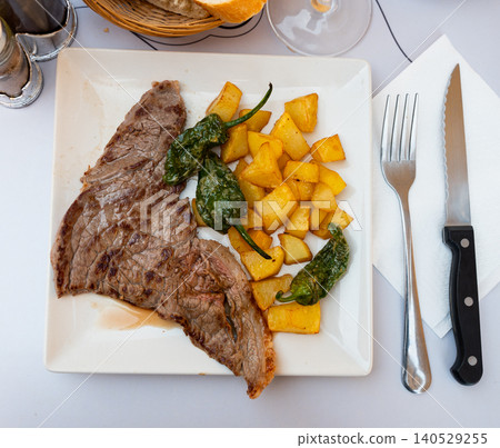 Grilled beef with roasted potatoes and bell peppers on plate Grilled beef with roasted potatoes and bell peppers on plate 140529255