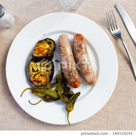 Pork sausages with grilled vegetables on a ceramic plate Pork sausages with grilled vegetables on a ceramic plate 140529291