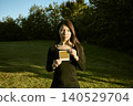 Three female dancers standing in an autumn park 140529704