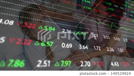 Holding child with braided hair lying in medical bed, parent placing hands, pink top, stock overlay 140529924