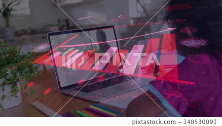 Showing laptop reflecting user at home desk, blue sleeve hand holding stylus on tablet, red overlay Showing laptop reflecting user at home desk, blue sleeve hand holding stylus on tablet, red overlay 140530091