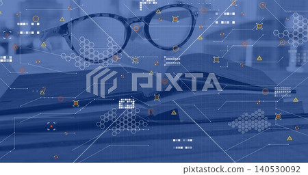 Resting round eyeglasses sitting on open printed book at desk, with hexagon HUD graphics overlay Resting round eyeglasses sitting on open printed book at desk, with hexagon HUD graphics overlay 140530092