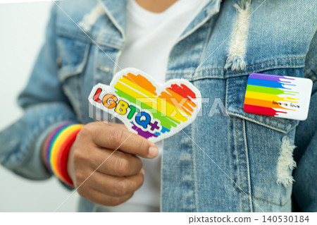 LGBT rainbow colorful flag heart and ribbon, symbol of lesbian, gay, bisexual, transgender, human rights, tolerance and peace. LGBT rainbow colorful flag heart and ribbon, symbol of lesbian, gay, bisexual, transgender, human rights, tolerance and peace. 140530184