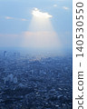 Light filtering through the clouds and the cityscape: Tokyo's streets evoke images of hope and the future. 140530550