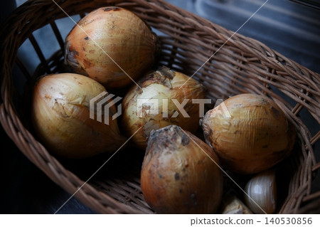 New onions in a colander New onions in a colander 140530856