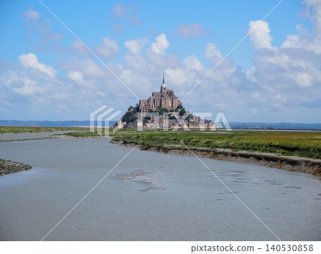 Mont Saint-Michel, a UNESCO World Heritage Site in France, against a blue sky. 140530858