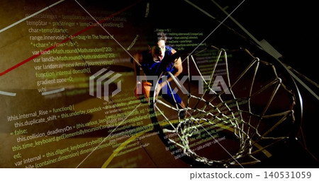 Leaping basketball player holding ball in blue kit heading toward rim on gym court, code projecting Leaping basketball player holding ball in blue kit heading toward rim on gym court, code projecting 140531059