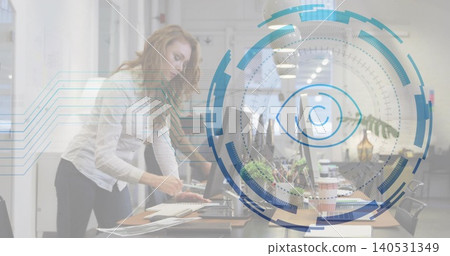Leaning woman in light blouse, dark pants typing papers in open-plan office, HUD eye, copy space Leaning woman in light blouse, dark pants typing papers in open-plan office, HUD eye, copy space 140531349