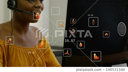 Talking woman in mustard blouse answering call at office desk with headset, monitor and UI overlays Talking woman in mustard blouse answering call at office desk with headset, monitor and UI overlays 140531380