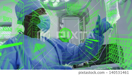 Manipulating green AR panels, male clinician adjusting IV bag inside ambulance bay in blue scrubs Manipulating green AR panels, male clinician adjusting IV bag inside ambulance bay in blue scrubs 140531461