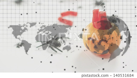 Showing mini jack-o'-lantern wearing red crown on grid mat, spider prop and map overlay, copy space Showing mini jack-o'-lantern wearing red crown on grid mat, spider prop and map overlay, copy space 140531684