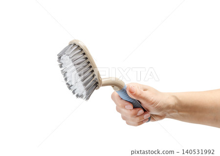 Woman holding a plastic brush on the white background. Woman holding a plastic brush on the white background. 140531992