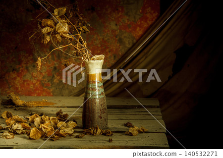 still life dried flowers in old vase on wood background still life dried flowers in old vase on wood background 140532271