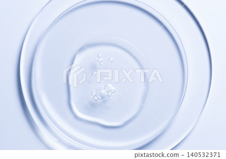 Skin serum or moisturizer or shower gel on a glass circle. A cosmetic product for body care. 140532371