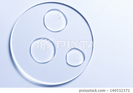 Skin serum or moisturizer or shower gel on a glass circle. A cosmetic product for body care. 140532372