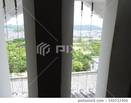 A view of the castle town from the latticed windows of Himeji Castle. A view of the castle town from the latticed windows of Himeji Castle. 140532408