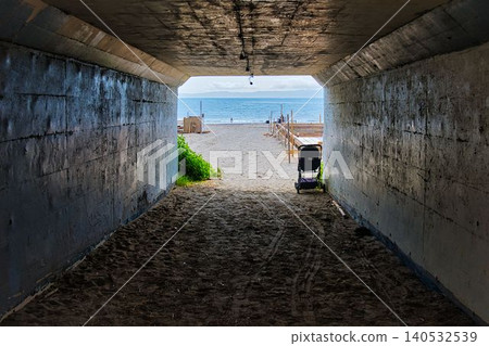 You can see the sea once you exit the tunnel. You can see the sea once you exit the tunnel. 140532539
