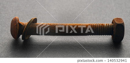 rusty construction bolt on a black background rusty construction bolt on a black background 140532941
