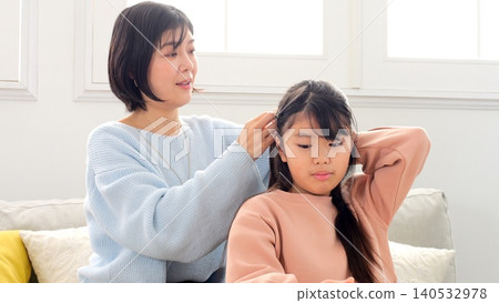 The image of tying your hair The image of tying your hair 140532978
