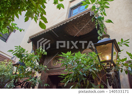 An intricately carved wooden porch adorns the main entrance to the elegant Riad Alice Terrace - Spa in Fez An intricately carved wooden porch adorns the main entrance to the elegant Riad Alice Terrace - Spa in Fez 140533171