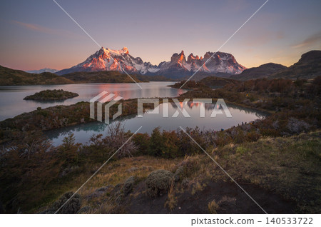 Patagonia mountain lake at sunrise with reflection and calm sky Patagonia mountain lake at sunrise with reflection and calm sky 140533722