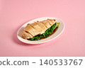Classic roasted chicken topped with garlic on pink 140533767