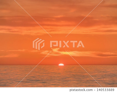 Orange sunset over calm sea at horizon Orange sunset over calm sea at horizon 140533889