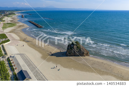 The coastline of Inasa Beach stretches along the Sea of Japan. The coastline of Inasa Beach stretches along the Sea of Japan. 140534883