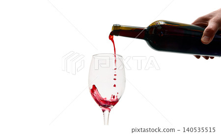 Pouring red wine into glass isolated on white background minimal elegant beverage concept 140535515