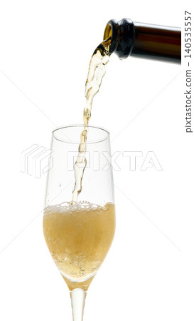 Sparkling wine filling champagne glass with foam isolated on white background 140535557