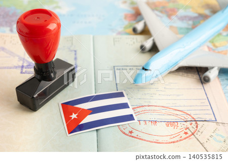 Cuba flag with passport and airplane for travel. Cuba flag with passport and airplane for travel. 140535815