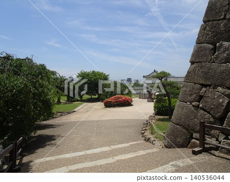 A view of the Nishinomaru garden and the important cultural property turret, as seen from near the "Ninomon" gate of Himeji Castle, with the city of Himeji stretching out in the distance. A view of the Nishinomaru garden and the important cultural property turret, as seen from near the "Ninomon" gate of Himeji Castle, with the city of Himeji stretching out in the distance. 140536044