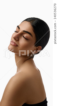 Side beauty portrait of woman with closed eyes and radiant skin on white background. 140536270