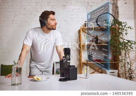 Man interacting with virtual fitness assistant interface in modern home interior. Man interacting with virtual fitness assistant interface in modern home interior. 140536395