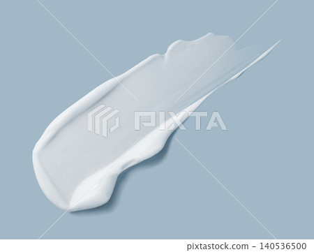 White cosmetic cream smear texture on blue White cosmetic cream smear texture on blue 140536500
