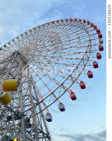Ferris Wheel Against Blue Sky at Amusement Park from Low Angle View, copy space no people. Ferris Wheel Against Blue Sky at Amusement Park from Low Angle View, copy space no people. 140536620