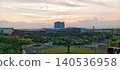 Dusk in a modern building area and a green roundabout 140536958